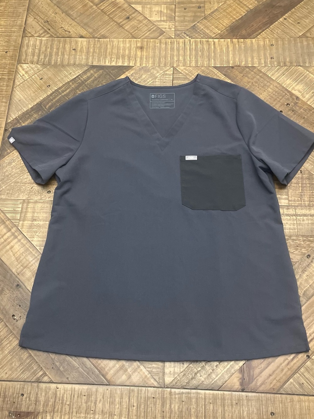 FIGS V-Neck Scrub Top in a charcoal or graphite gray colorway